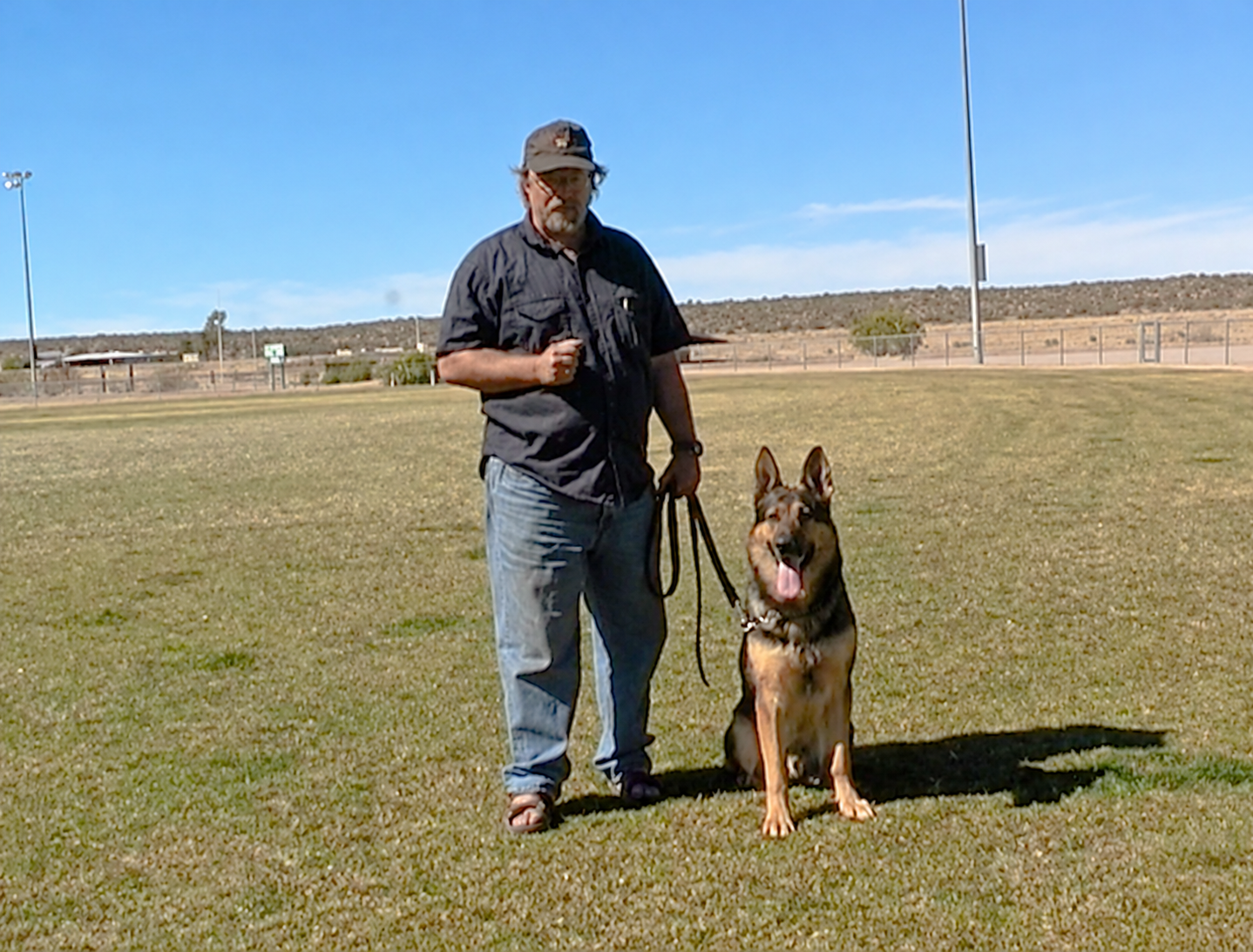 Hans working with a German Shepherd on the training field